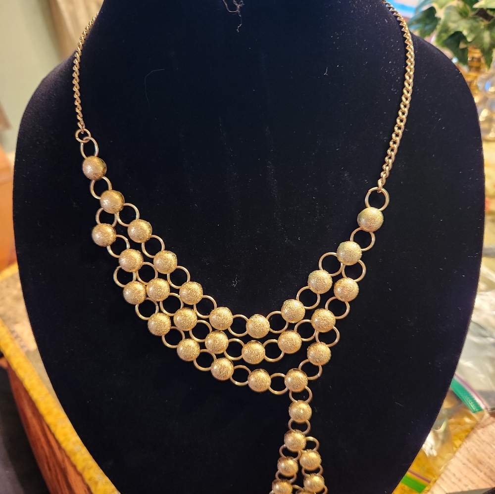 Gold colored statement necklace